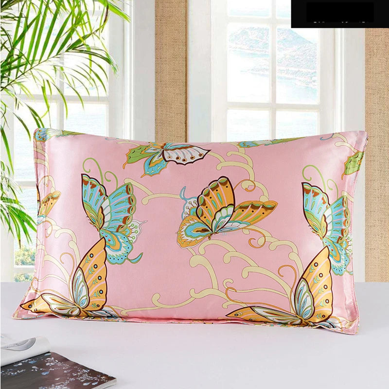 Pink pillowcase with butterfly design on a bed in a bright room.