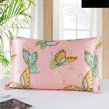 Pink pillowcase with butterfly design on a bed in a bright room.