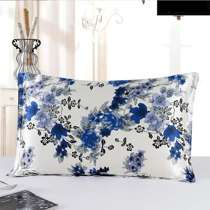 Floral patterned pillow on a white surface with a blurred background