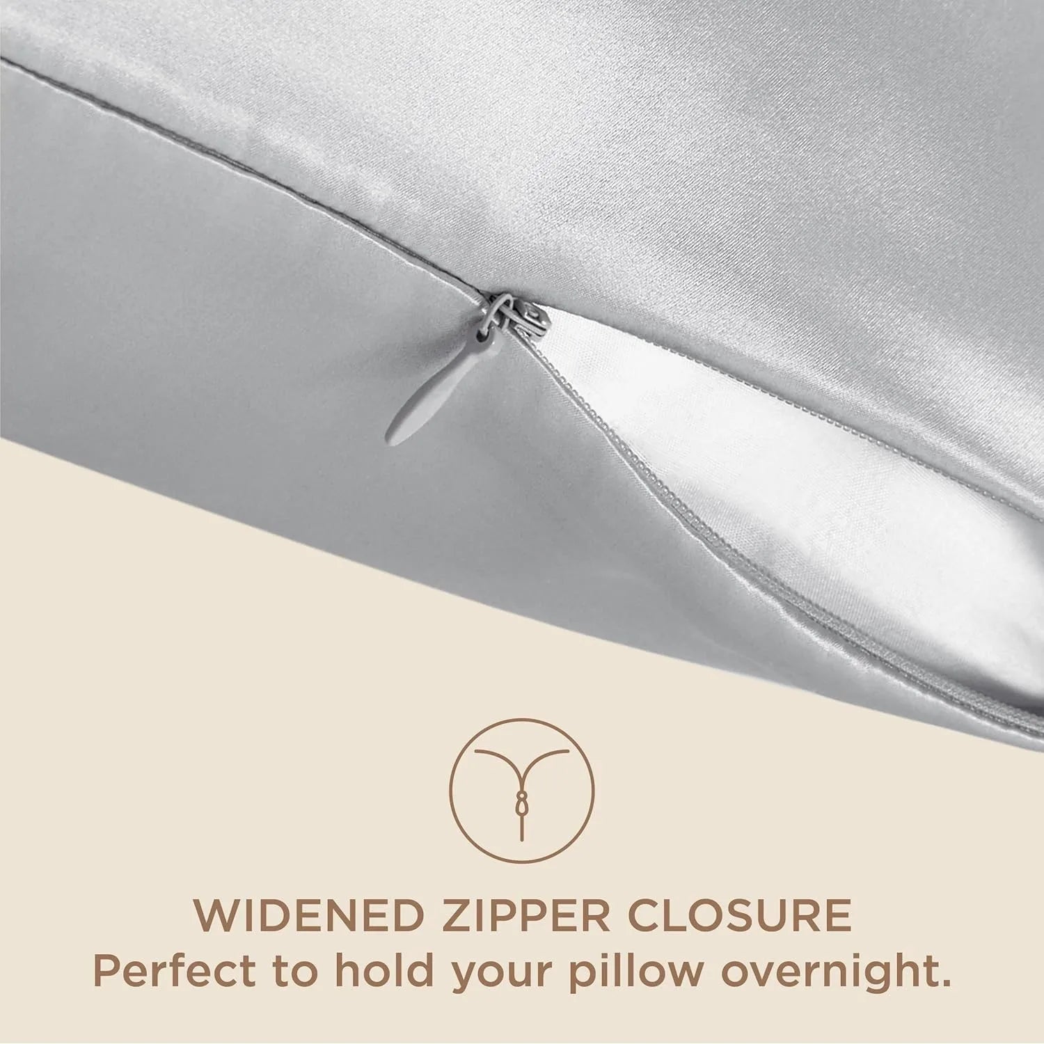 Silver pillow with widened zipper closure on a beige background