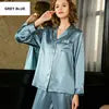 Woman wearing a blue outfit with a blurred background