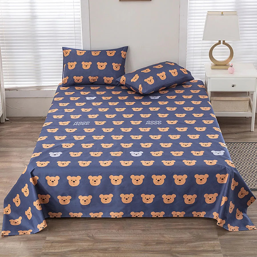 Bedspread with teddy bear pattern on a bed in a bedroom setting.