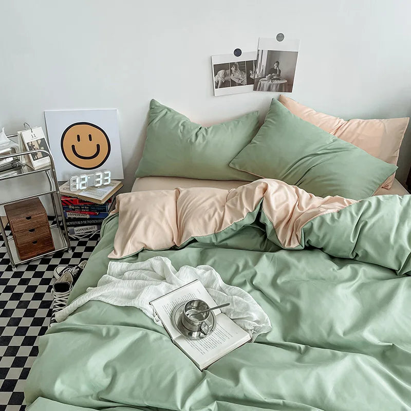Bed with green and pink bedding in a room with a checkered floor.